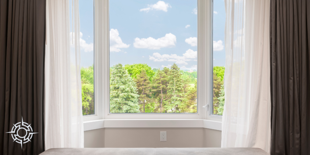 bay windows with forest and sky
